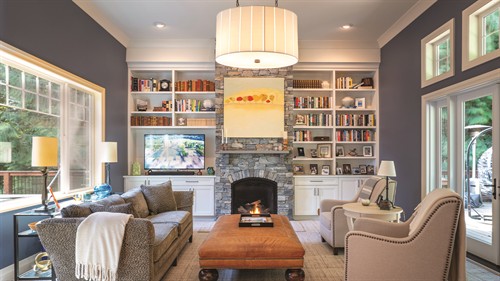Den with drystack fireplace surround