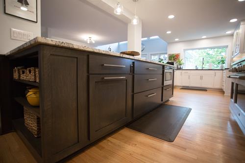 Add style and interest to your kitchen with contrasting cabinetry color and granite on your island.