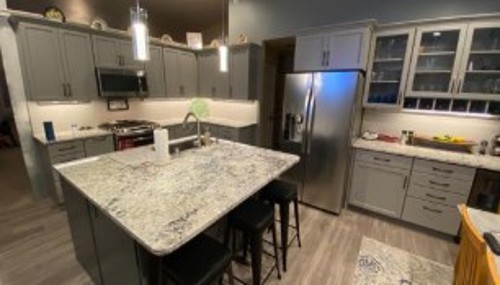 Custom kitchen island installation with premium countertops completed by Alderwood Builders in Bellingham, WA.