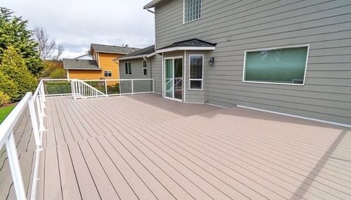 Spacious composite deck installation designed for outdoor living and entertaining, done by Kingsmen Construction and Kingsmen Painting for a Whidbey Island homeowner.