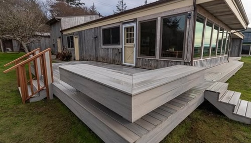 Deck renovation project completed by Kingsmen Painting, creating a functional and attractive outdoor living space overlooking the beautiful Pacific Northwest landscape.