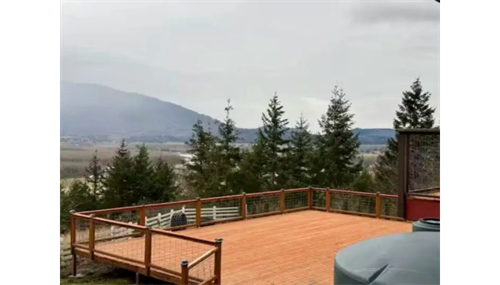 Spacious custom-built deck with cable railing showcasing panoramic mountain and valley views ā craftsmanship by Nexo Insulation & Construction. Spacious custom-built deck with cable railing showcasing panoramic mountain and valley views ā craftsmanship by Nexo Insulation & Construction.