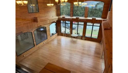 Open-concept loft view with expansive windows and handcrafted timber design by Nexo Insulation & Construction. Open-concept loft view with expansive windows and handcrafted timber design by Nexo Insulation & Construction.