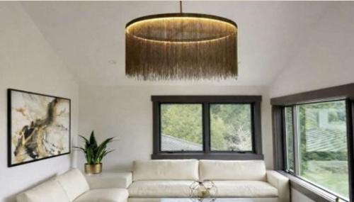 Contemporary living room design with custom lighting by D Studio 11, serving Camano Island, Skagit Valley, and Snohomish County with elevated interiors, natural light, and modern finishes.