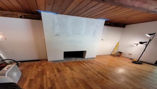 Drywall installation and repair inside a Northwest Washington home with new wallboard, mudding, and tape applied.