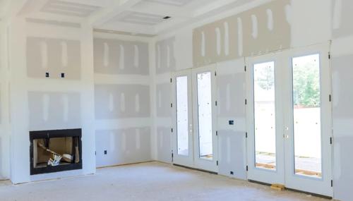 Island County drywall repair project featuring resurfaced fireplace wall and prep work for interior refinishing