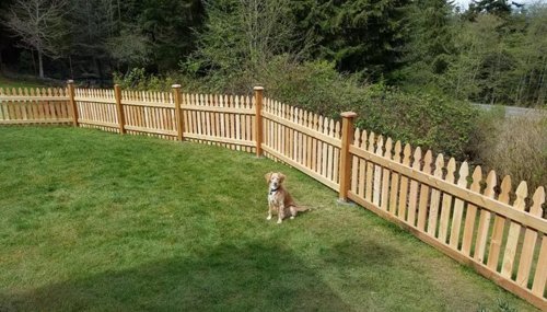 Custom cedar picket fence installation in Oak Harbor, WA providing privacy, security, and curb appeal for residential properties.