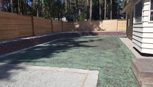 Engineered retaining wall and yard leveling project in Anacortes, WA to maximize usable outdoor living space.