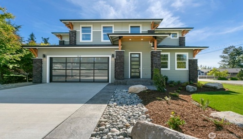 Contemporary craftsman home in Bellingham, WA with stone accents, covered entry, and modern architectural design.