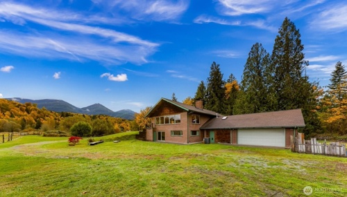 Scenic countryside home in Conrete, WA with mountain views, open acreage, and peaceful rural landscape.