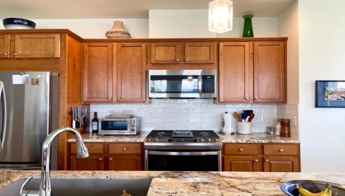 Beautiful kitchen renovation featuring custom cabinetry, granite countertops, and updated finishes in Oak Harbor, WA.