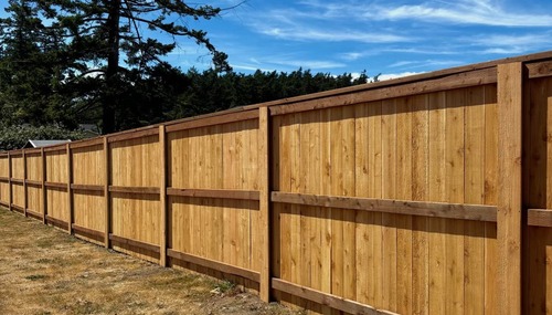 Custom cedar privacy fence installed by C&W Fencing for added security and backyard privacy in Island County, WA.