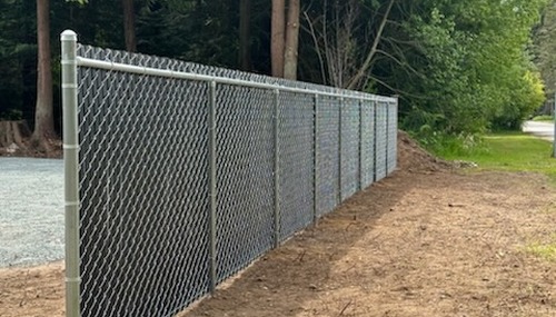 Durable chain-link fence installation by C&W Fencing for a residential or commercial property in Skagit County, WA.