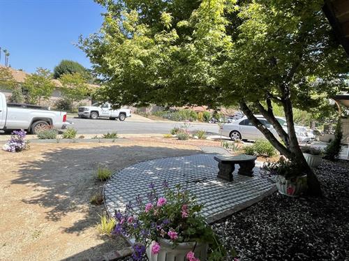 Grass area conversion to waterwise landscaping with hardscaping