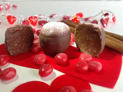 chocolate surrounded by cinnamon and red candies for Valentine's day