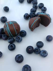 chocolates surrounded by blueberries