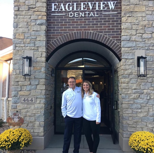 Owners in front of building at Eagleview Dental