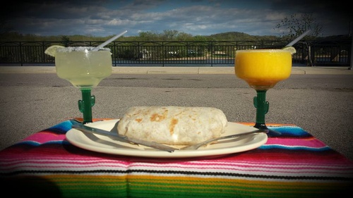 Burrito with two margaritas outside