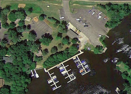 Aerial view of Lake with boats parked on dock