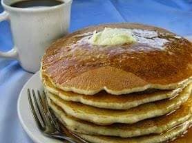 stack of pancakes with a coffee