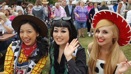 3 women dressed up as cowgirls at the Cow Chip festival