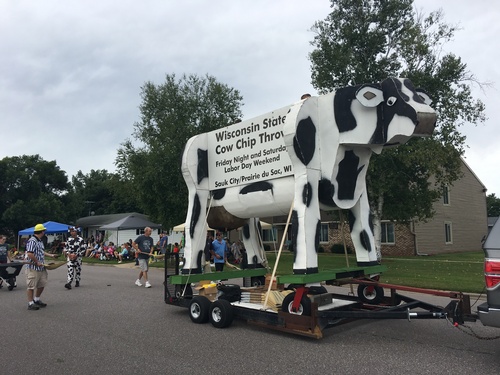 Large fake Cow on a trailer