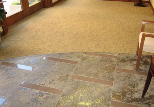 tile flooring with rounded edge connected to carpet