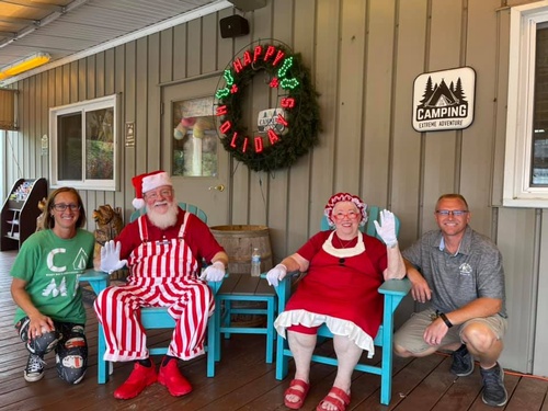 Owners posing with santa