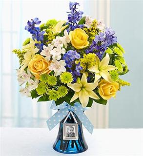 vase with a bouquet of purple, yellow, and white assorted flowers