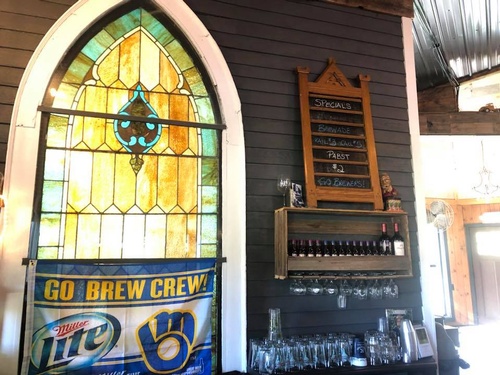 inside view of stained glass windows and bar at the old schoolhouse