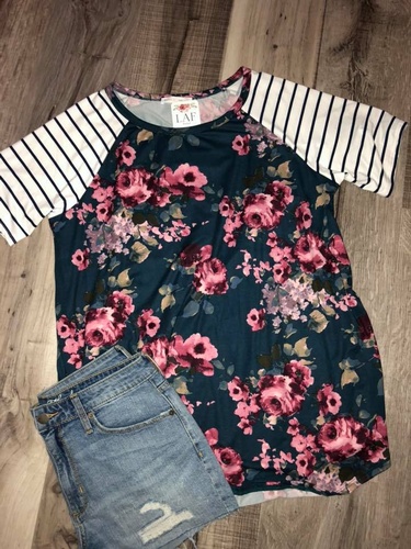 Floral print top and jean shorts on display