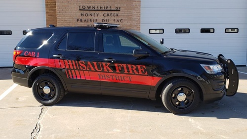 Sauk Fire District car parked outside the fire department
