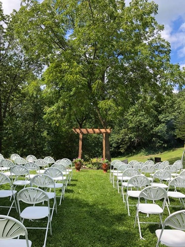 Outdoor wedding ceremony setup at The Vines