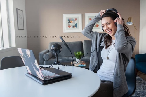 Podcaster woman smiling with headphones on
