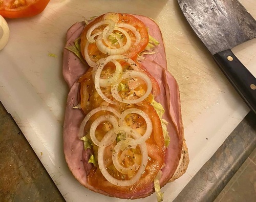 Deli Sandwich with tomato, lettuce, and onion from WOW Sammiches