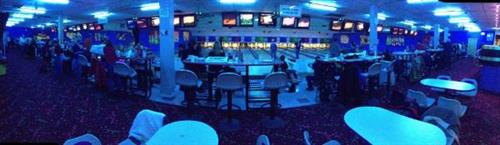 Cosmic bowling.  Bowl under flashing glow in the dark lights.