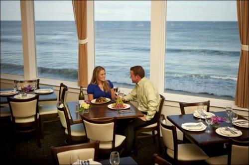 Along the front windows, tables are literally over the ocean.
