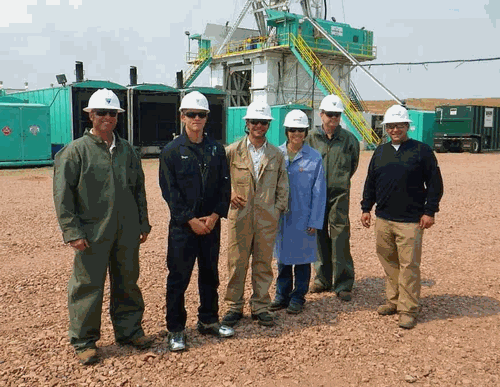 BLM and Devon employees in front of rig site on education day