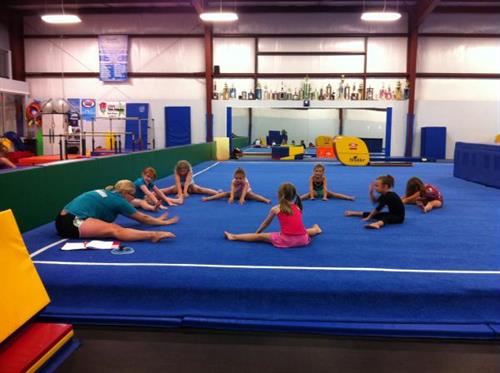Gymnastics class starting by stretching.