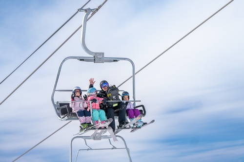Gallery Image Family%20at%20AZSB%20on%20Chairlift%20-%20Courtesy%20of%20Arizona%20Snowbowl%20(1).jpg