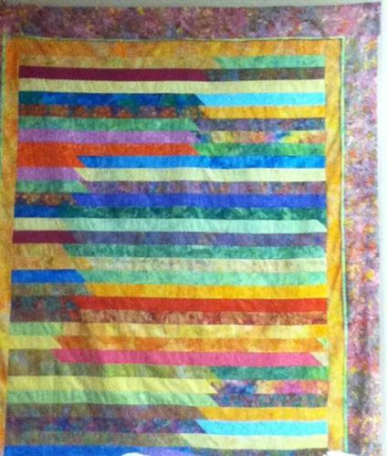 Easy quilt made from a bali pop (2 1/2''  batik ) and a few  borders. Pattern free with the purchase or a  jelly roll or bali pop.