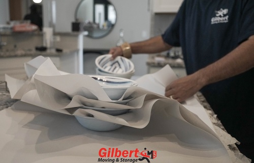 Gallery Image gilbert-packing-dishes.jpg