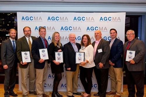 Gilbane Building Company leadership team in Boston, MA receiving the AGG Build New England Award. 