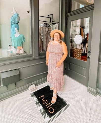 Owner, Sadie Gravel in front of her boutique