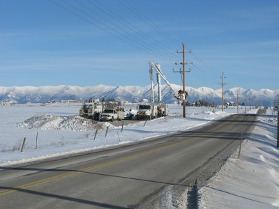 Flathead Electric Co op line crews work on poles and lines year round in all weather. 