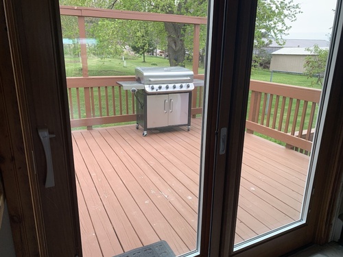 Deck is off from kitchen/dining area. Gas BBQ grill is furnished.