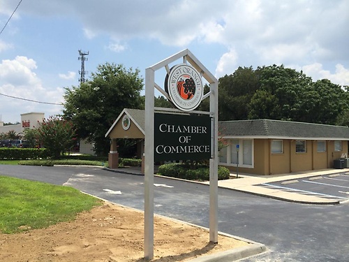 Proudly displaying the Chamber's new sign