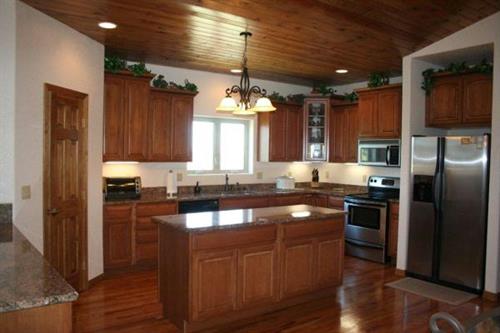 Cactus pine wood ceiling and red oak floors with upgraded appliances