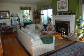 Sit by the fire in our comfy Cape Cod style living room