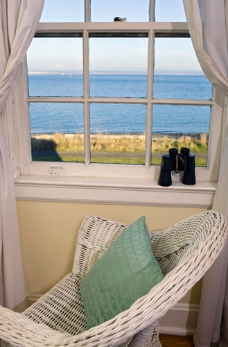 Watch for whales, cargo ships and military vessels from the Island View Room